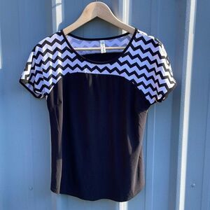 PERCECUTION'S • size small short sleeve black with zigzag pattern •